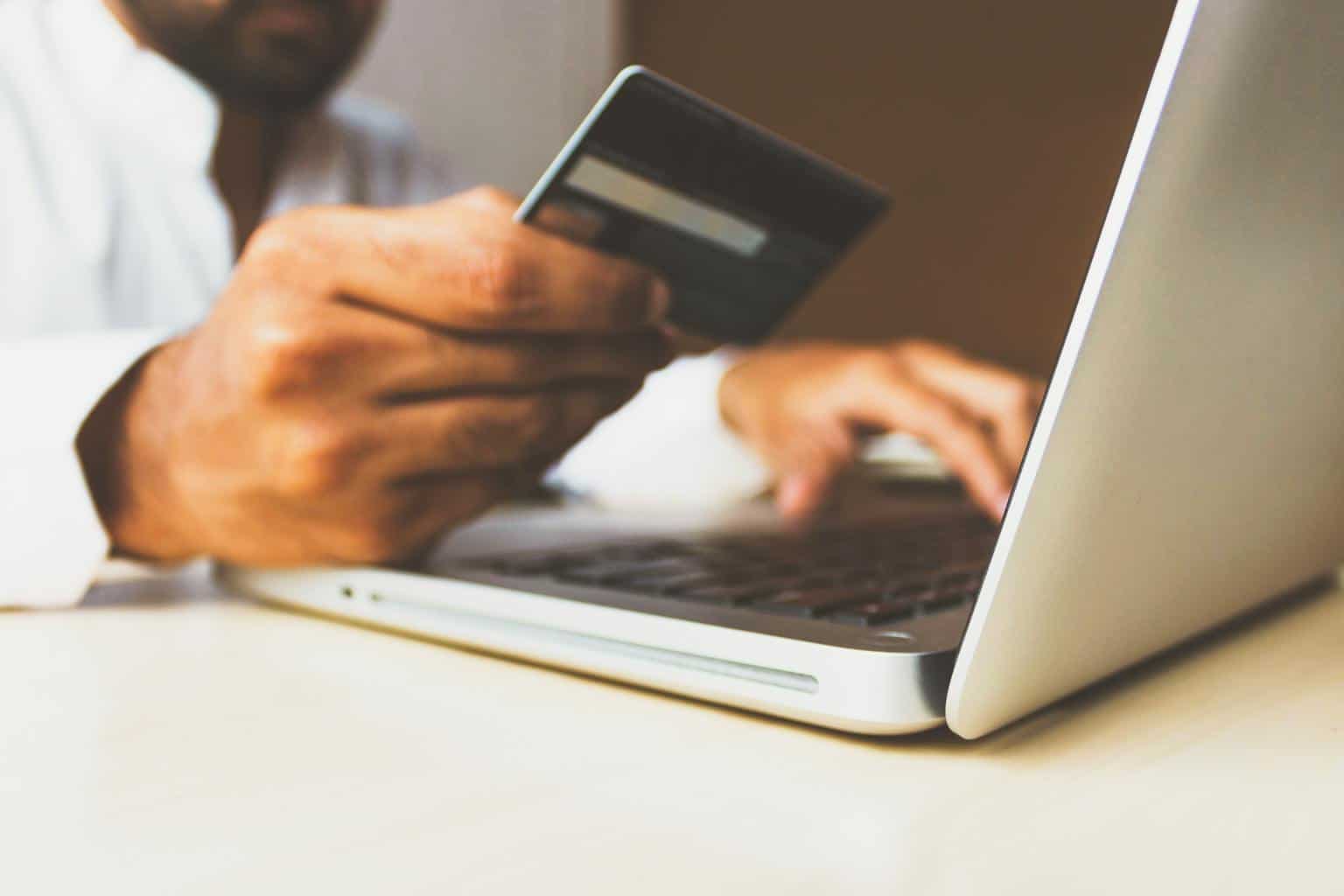person using a business credit card to buy something online
